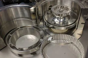 Industrial grinding mill with components and internal parts displayed